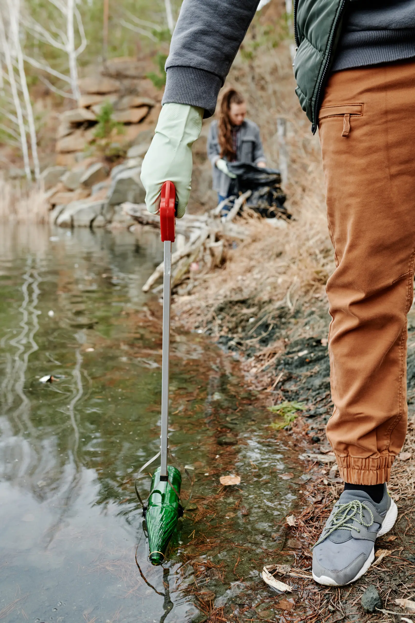 Man Cleaning Forest Lake